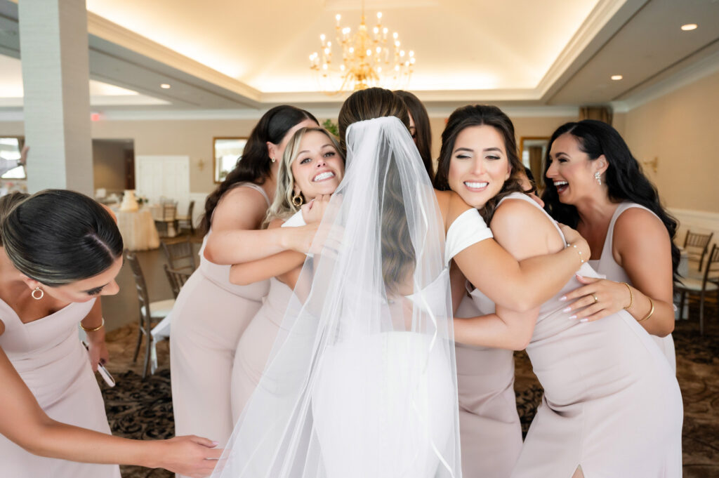 bridesmaids hugging their friend bride • How to plan a Bridesmaids First Look • Pittsburgh Weddings