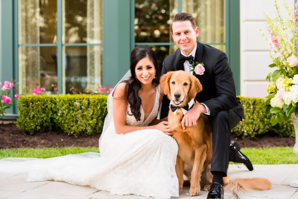 bride and groom with their dog in wedding photo at nemacolin resort • Nemacolin Woodlands Resort Weddings - Luxury Events Photos