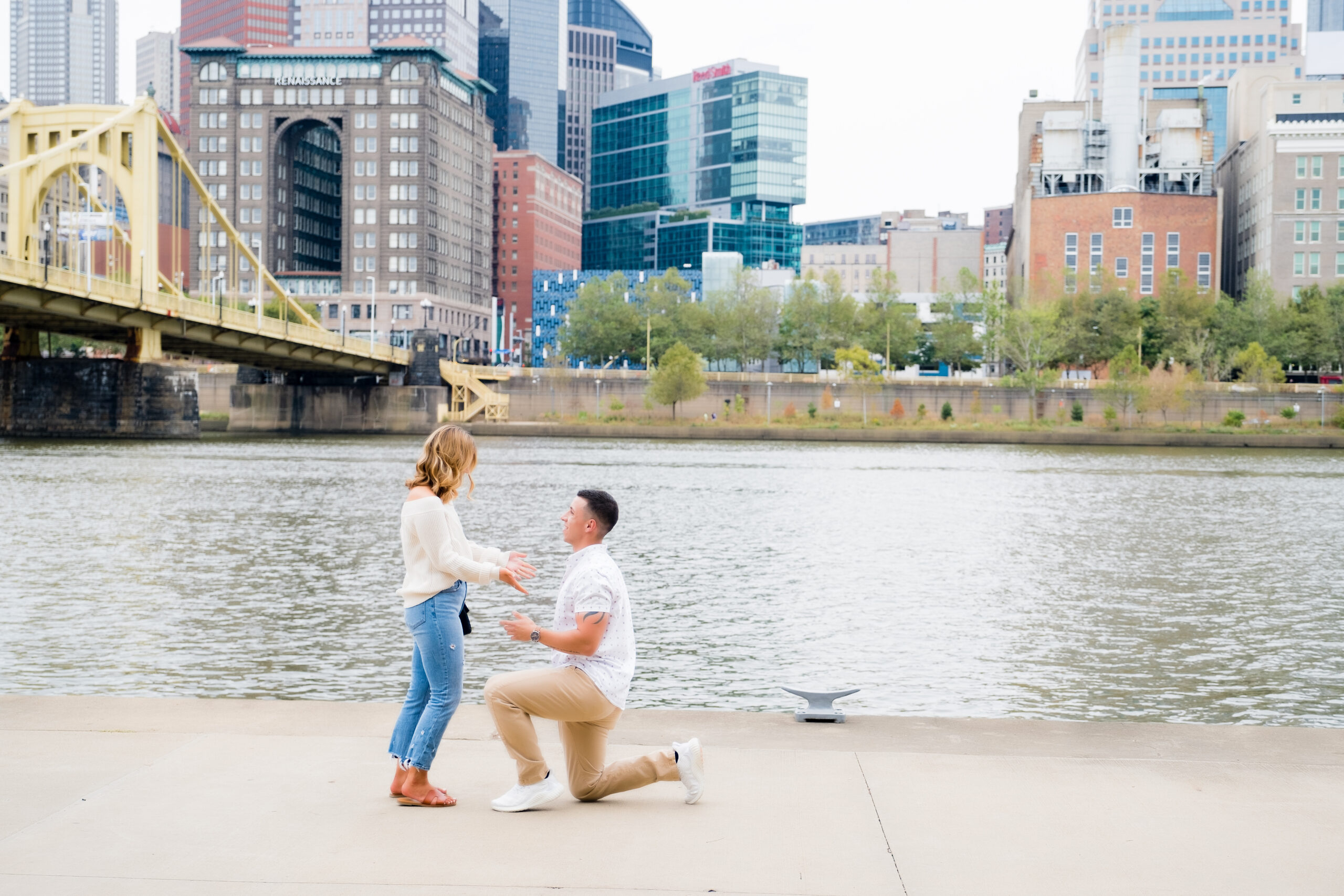 engaged couple hugging after proposal • Pittsburgh Surprise Proposal Photography | Engagement