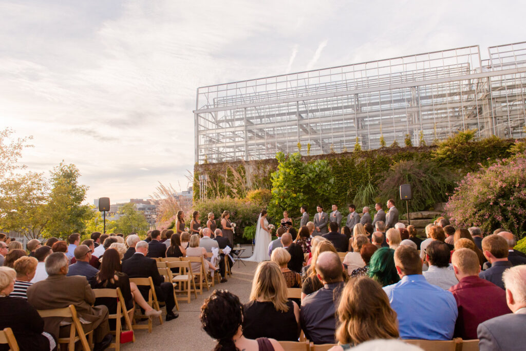wedding ceremony on the outdoor patio outside of tropical rainforest room at phipps • Phipps Conservatory Weddings