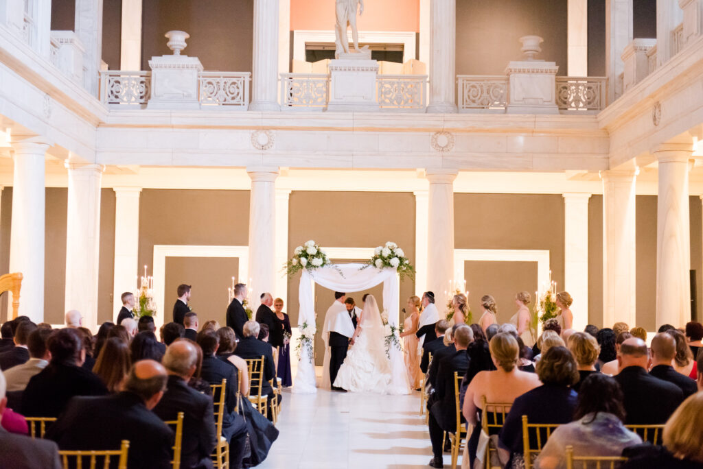 wedding ceremony in the hall of sculpture at the carnegie museum • Carnegie Museum of Art and Natural History Weddings