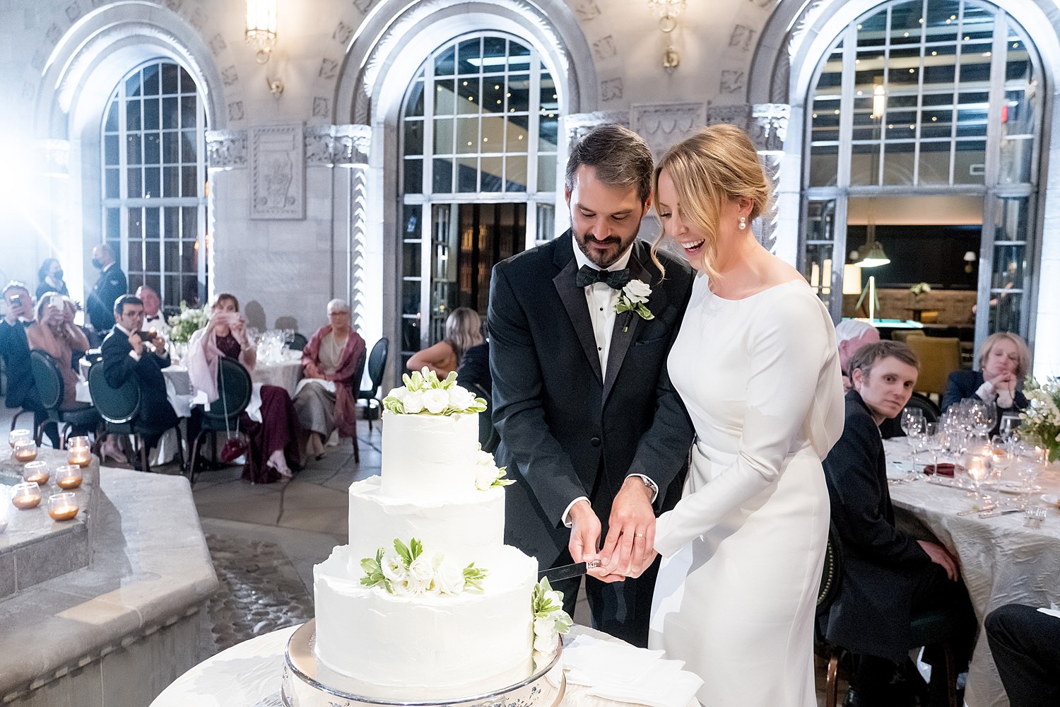 wedding reception cake cutting in duquesne club courtard • Duquesne Club Weddings