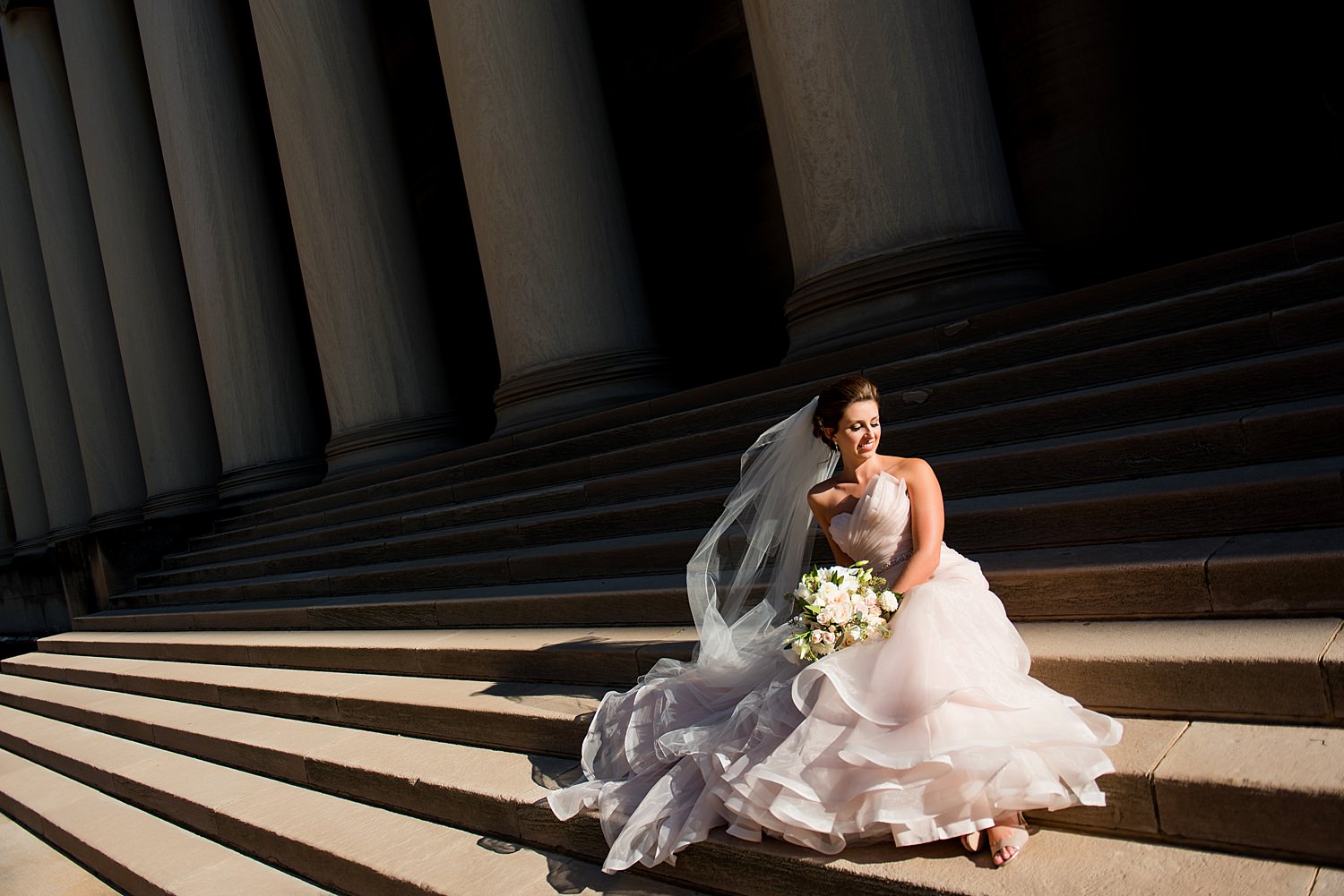 wedding photo on mellon institute pillars in pittsburgh • Recommended Vendors
