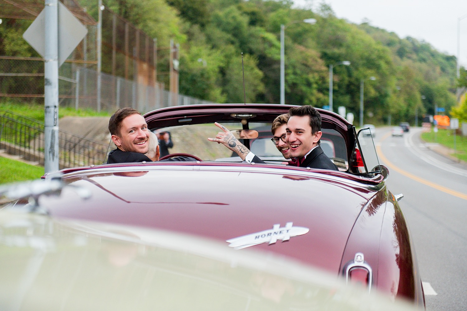 wedding party driving in classic cars • Recommended Vendors