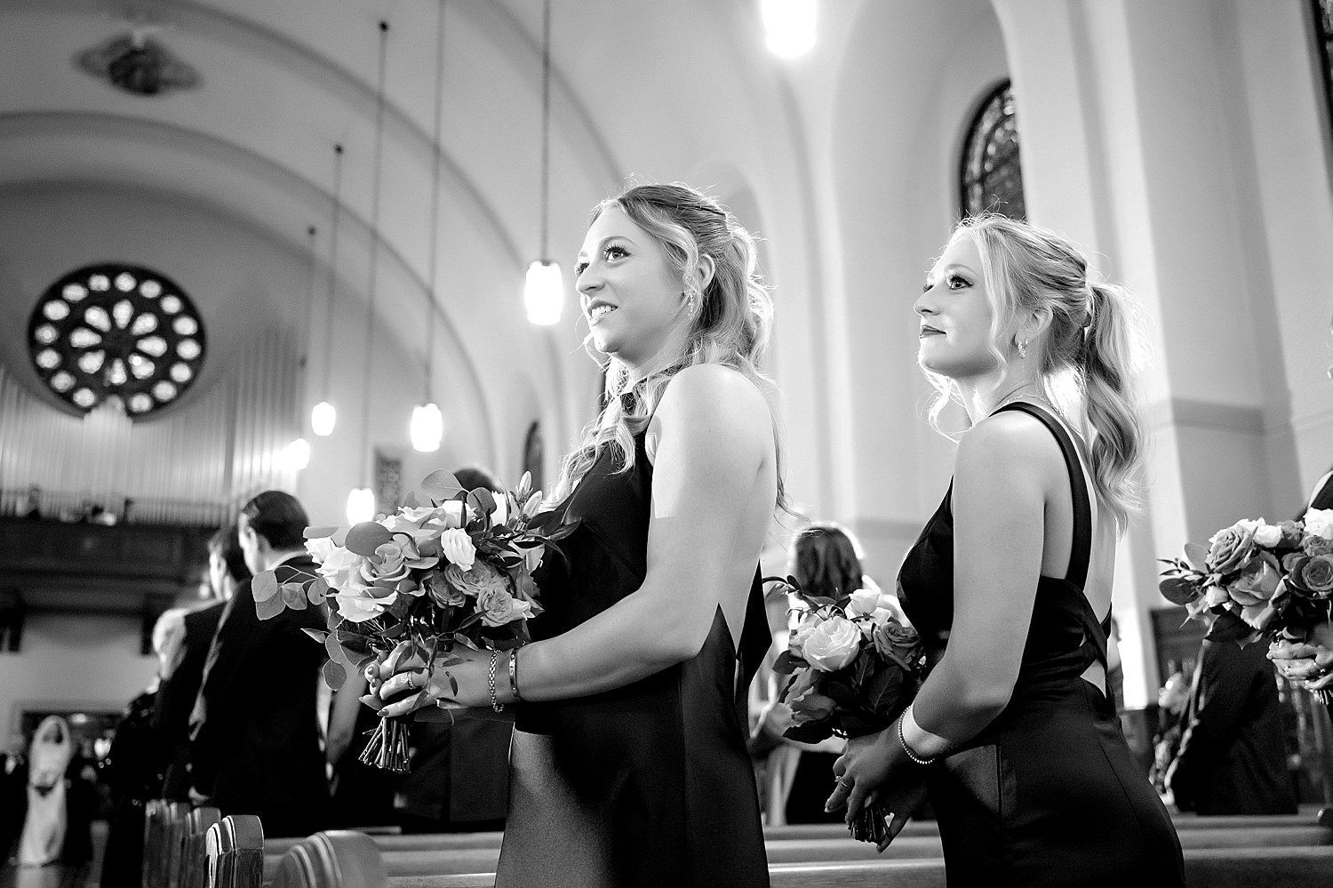 sisters watching their brother the groom during wedding processional • Love at First Sight: Wedding at the Omni William Penn and St Rosalia Church