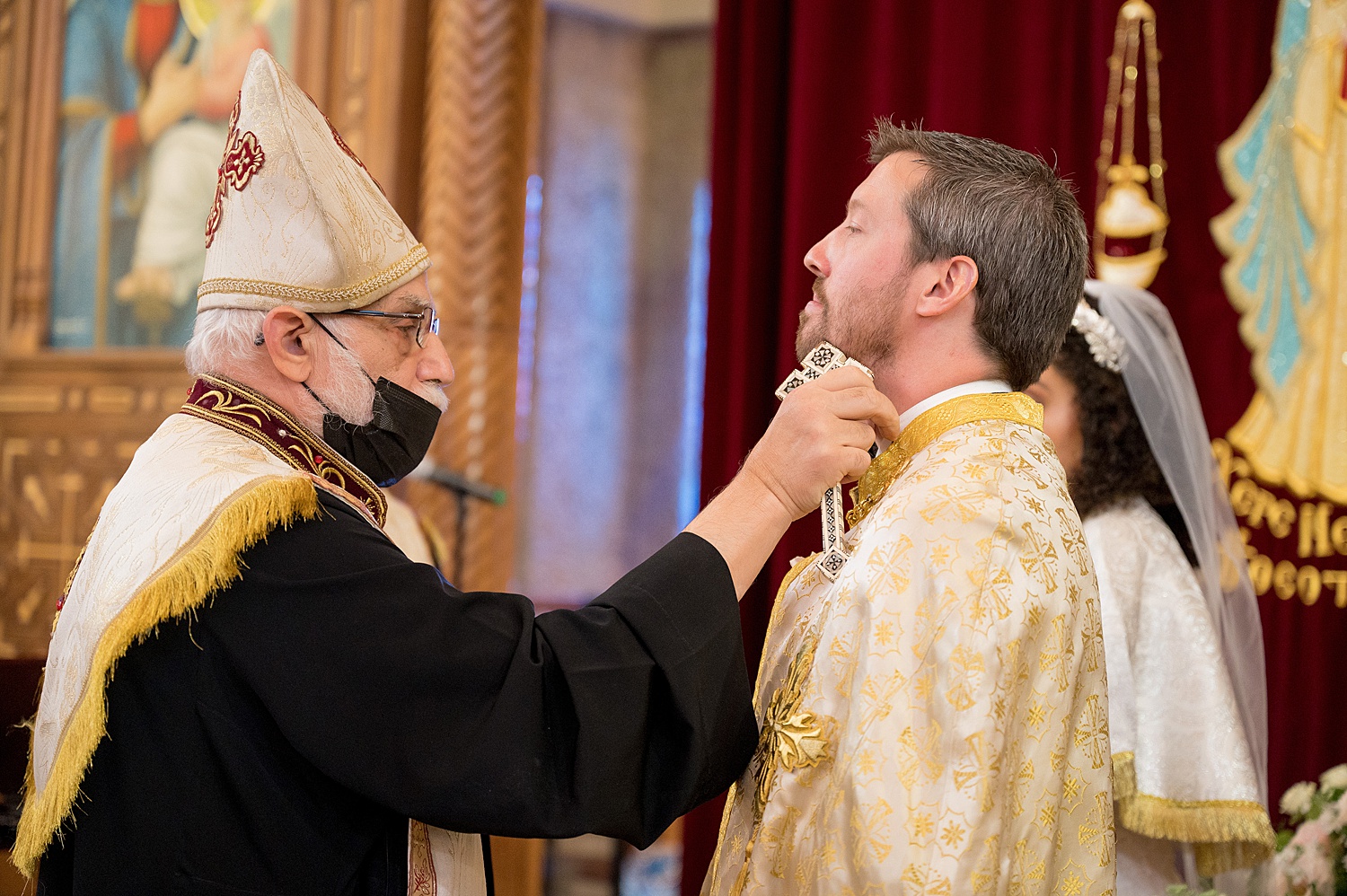 Groom getting anointment oil during Coptic Orthodox Wedding Ceremony • Coptic Orthodox Ceremony: How to Photograph a Wedding at St Mary's Church in Ambridge Pittsburgh
