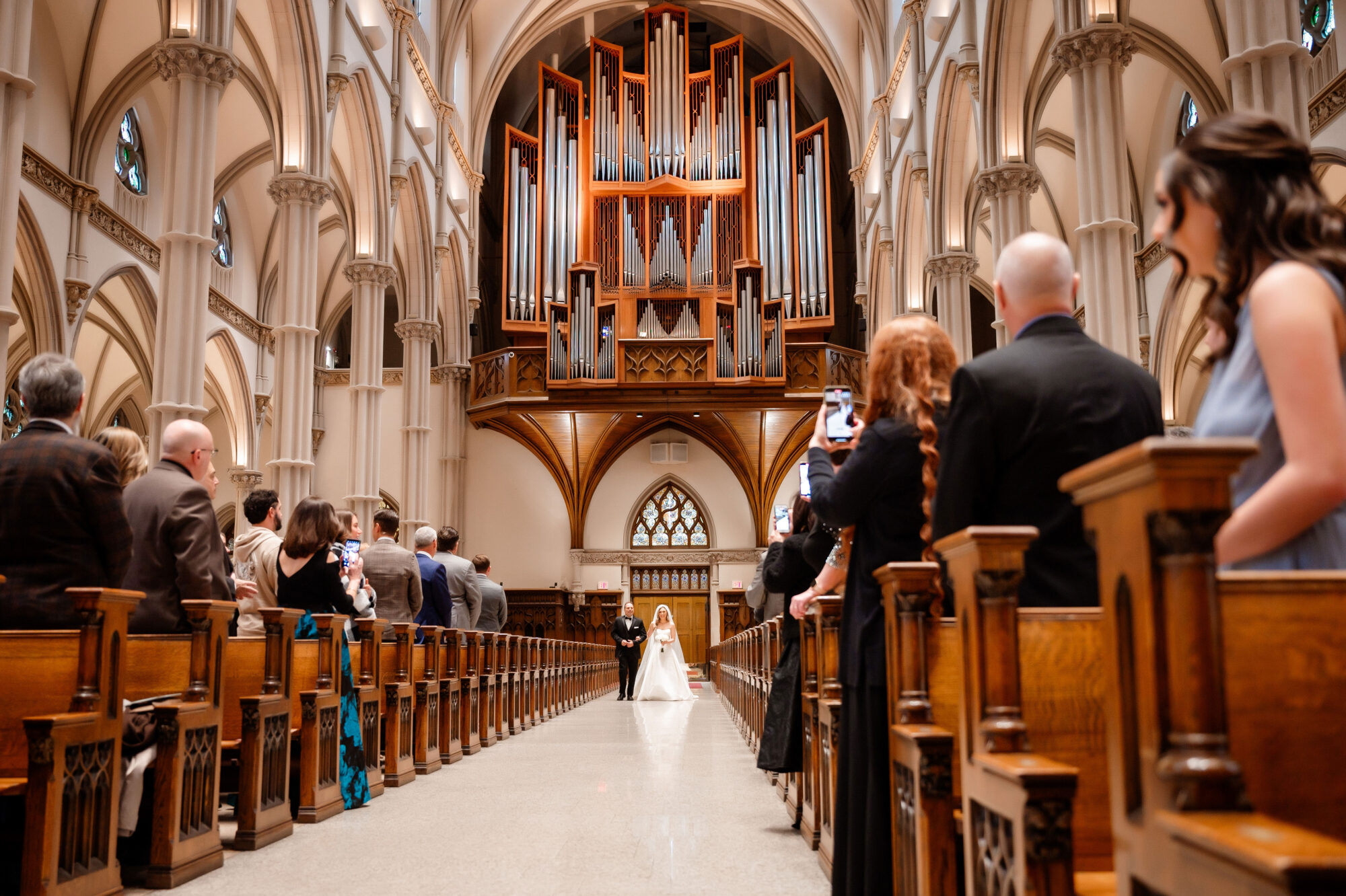 bride coming down the aisle at st paul catehdral in pittsburgh pennsylvania • Stunning Duquesne Club Wedding Photos - An Elegant Wintery January Pittsburgh Marriage