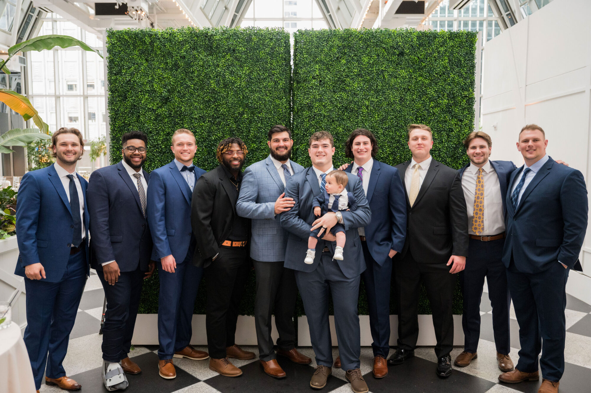 cocktail hour group photo at ppg wintergarden pittsburgh • PPG Wintergarden Weddings: Modern Glass-Walled Pittsburgh Receptions You'll Love!